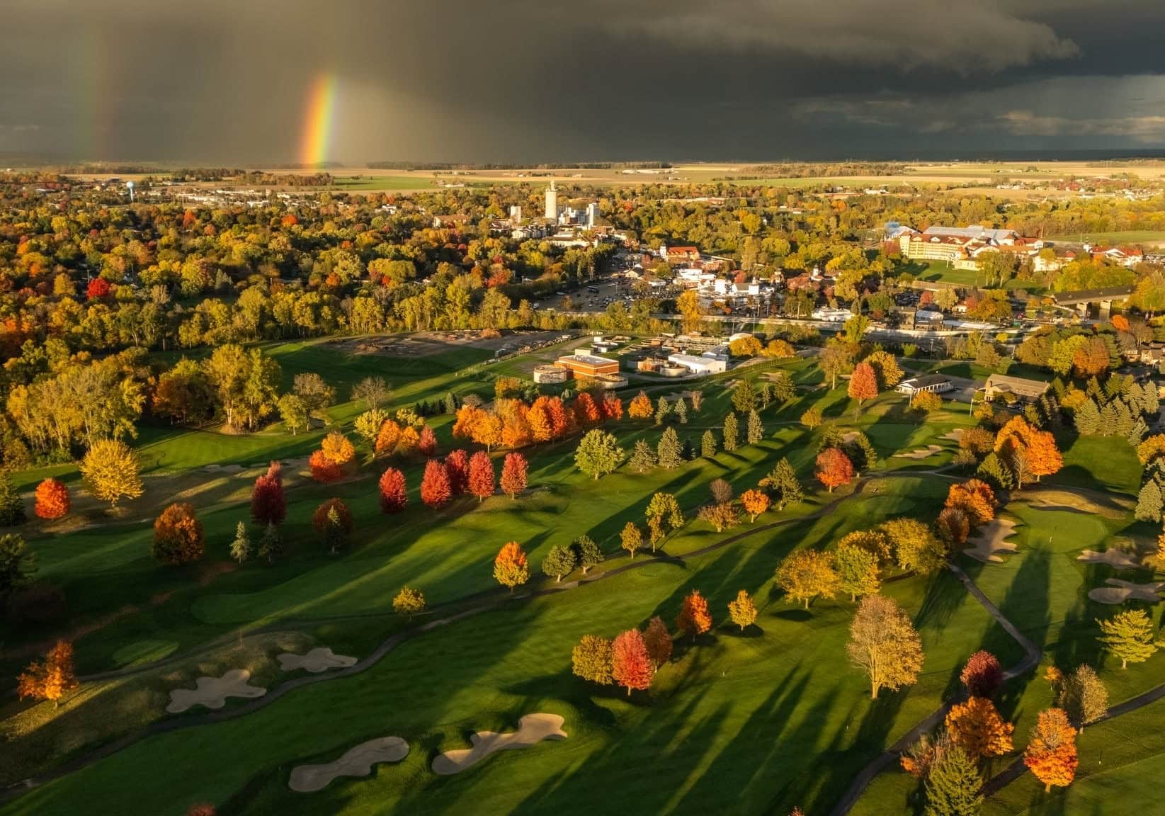 Storm light and a double rainbow over the town of Frankenmuth seen from The Fortress fairways