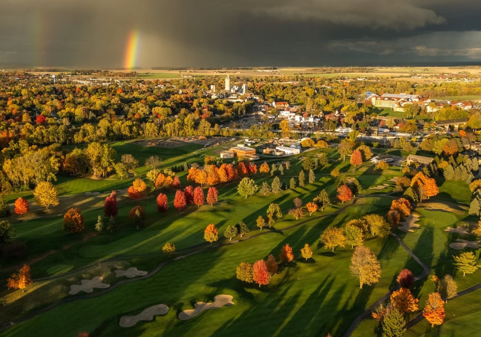 Storm light and a double rainbow over the town of Frankenmuth seen from The Fortress fairways