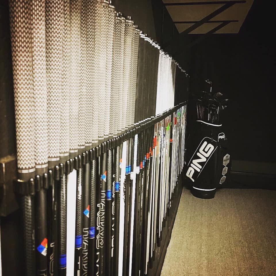 Wall rack of fitting shafts inside the Trackman Studio at The Fortress
