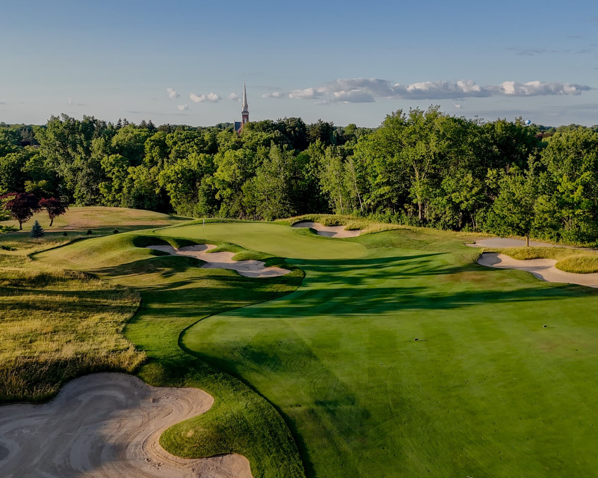 Aerial over the closing holes at The Fortress in summer evening light